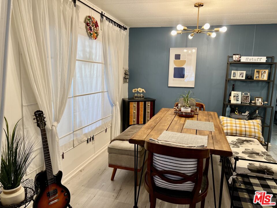 2744 West Rialto Avenue, Unit 49 Rialto, CA 92376 - Photo 11 of 40 a view of a dining room with furniture window and wooden floor