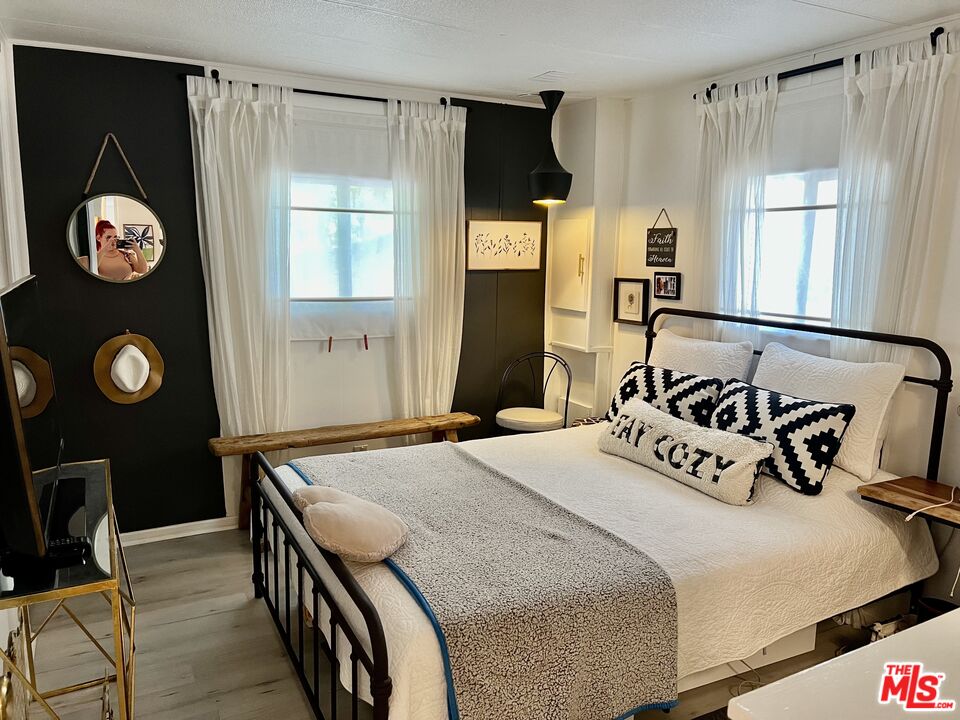 2744 West Rialto Avenue, Unit 49 Rialto, CA 92376 - Photo 13 of 40 a bedroom with a bed and a window