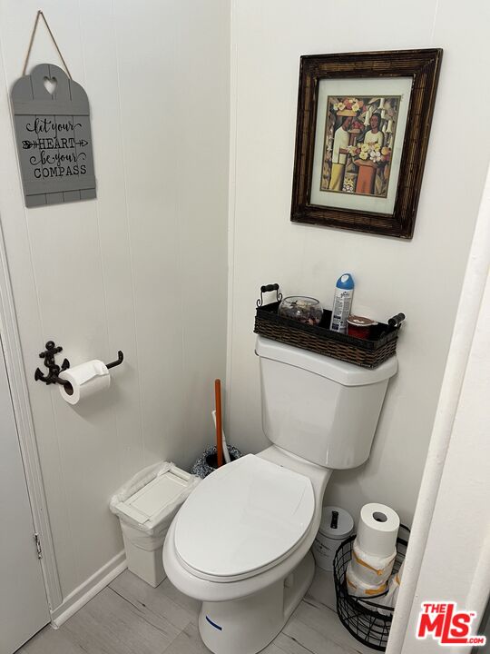2744 West Rialto Avenue, Unit 49 Rialto, CA 92376 - Photo 18 of 40 a white toilet sitting next to a bathroom sink