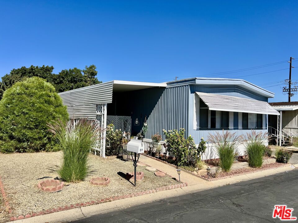 2744 West Rialto Avenue, Unit 49 Rialto, CA 92376 - Photo 2 of 40 a view of a house with a yard