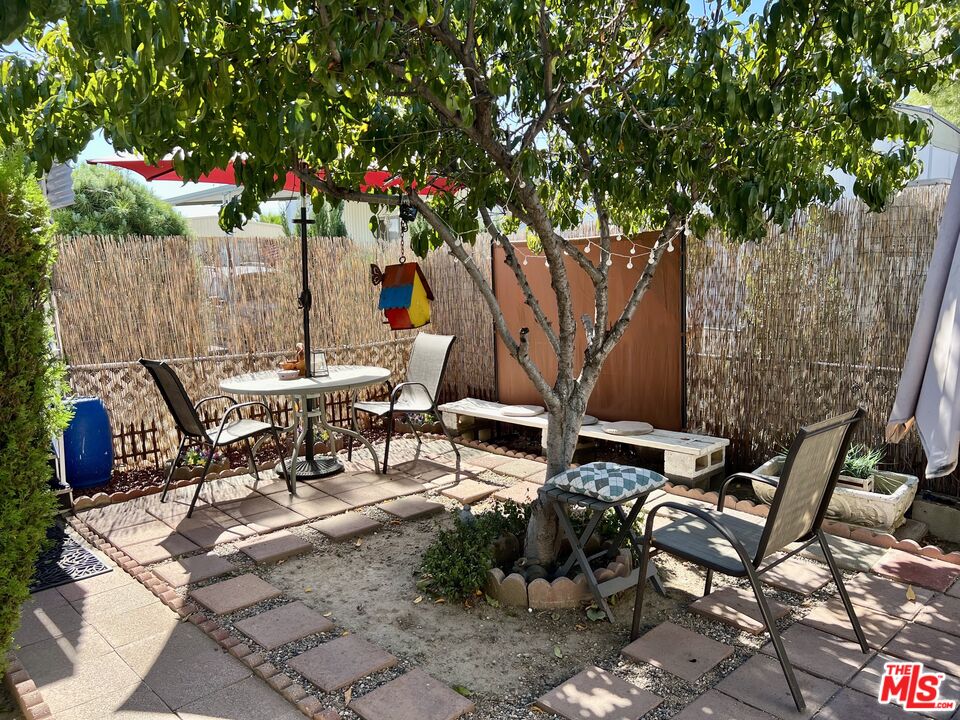 2744 West Rialto Avenue, Unit 49 Rialto, CA 92376 - Photo 30 of 40 a view of a backyard with sitting area