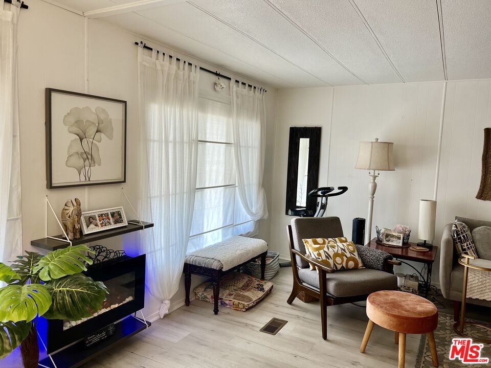 2744 West Rialto Avenue, Unit 49 Rialto, CA 92376 - Photo 5 of 40 a living room with furniture and a window