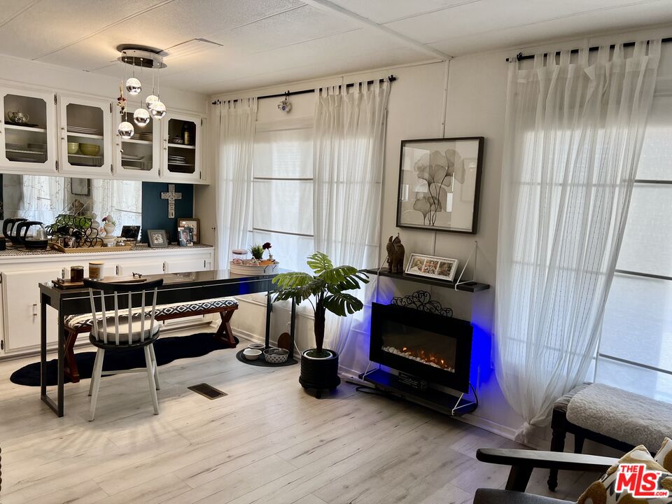 2744 West Rialto Avenue, Unit 49 Rialto, CA 92376 - Photo 6 of 40 a living room with furniture and a fireplace