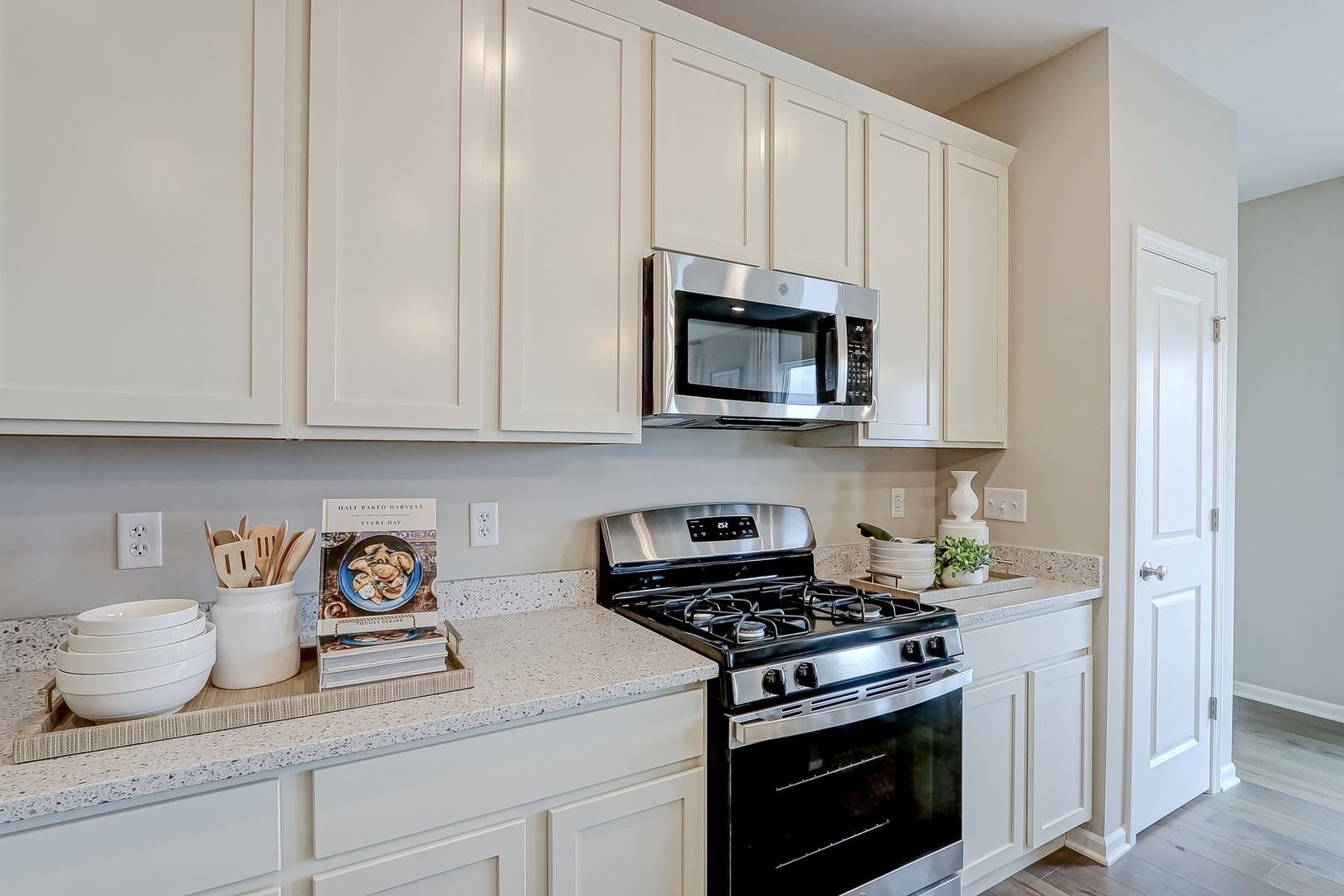 548 Endicott Road South Elgin, IL 60177 - Photo 11 of 32 a kitchen with stainless steel appliances granite countertop white cabinets and a stove top oven