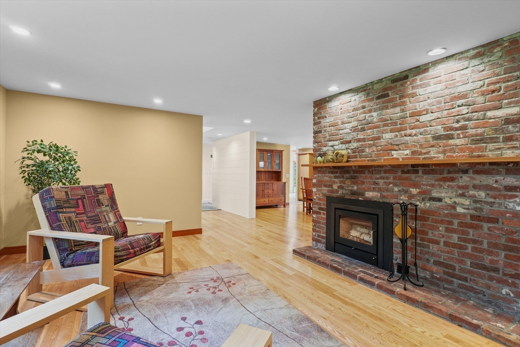 146 Spofford Road Boxford, MA 01921 - Photo 12 of 42 a living room with furniture and a fireplace