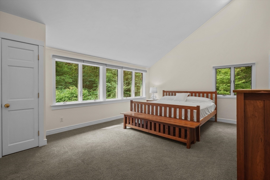 146 Spofford Road Boxford, MA 01921 - Photo 20 of 42 a bed sitting in a bedroom next to a window