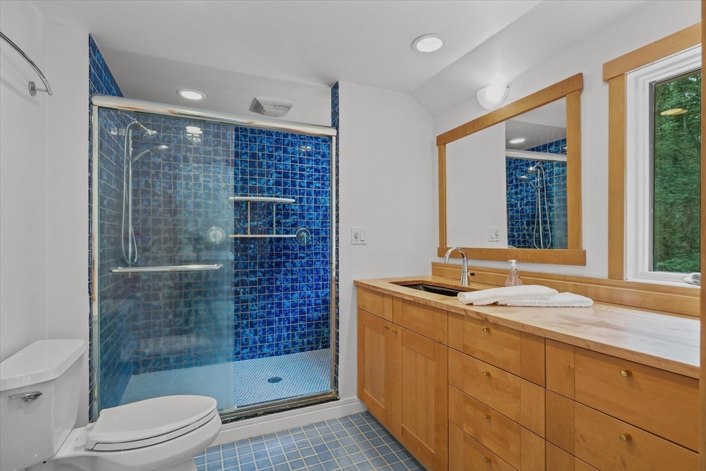 146 Spofford Road Boxford, MA 01921 - Photo 22 of 42 a bathroom with a sink a toilet and shower