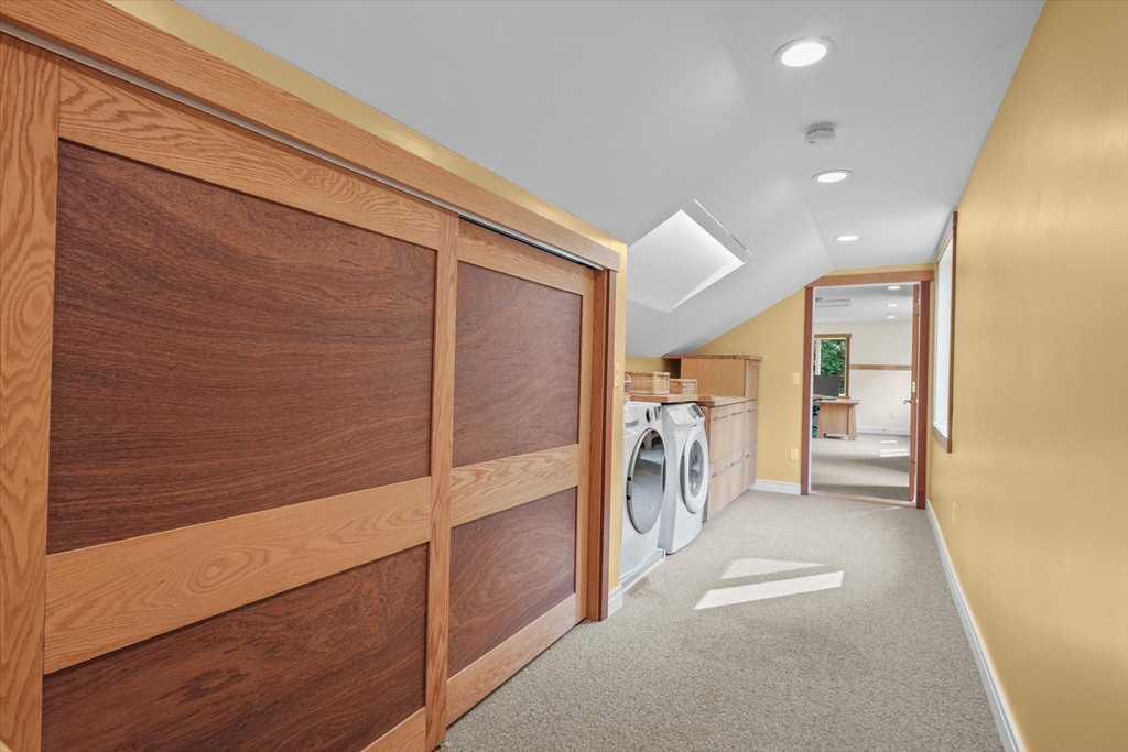146 Spofford Road Boxford, MA 01921 - Photo 27 of 42 a view of a hallway with white cabinets