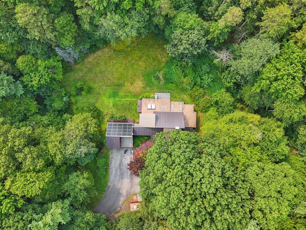 146 Spofford Road Boxford, MA 01921 - Photo 39 of 42 an aerial view of a house with yard and outdoor seating