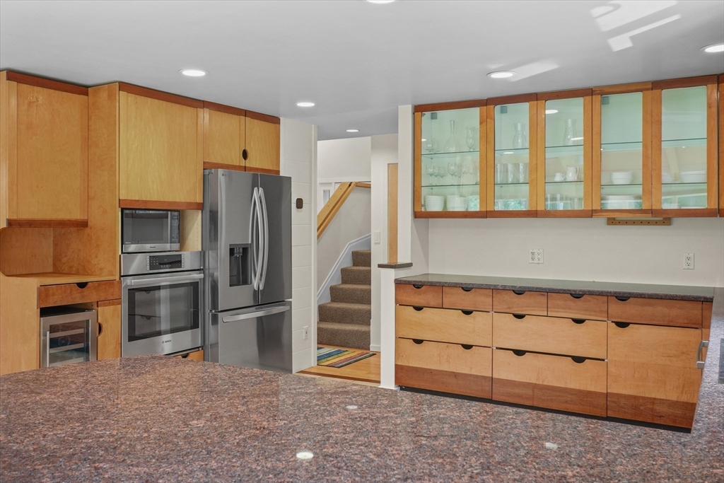 146 Spofford Road Boxford, MA 01921 - Photo 5 of 42 a view of kitchen with stainless steel appliances wooden floor and window