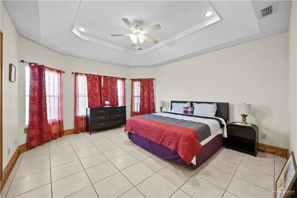 a spacious bathroom with a granite countertop sink a mirror and a shower