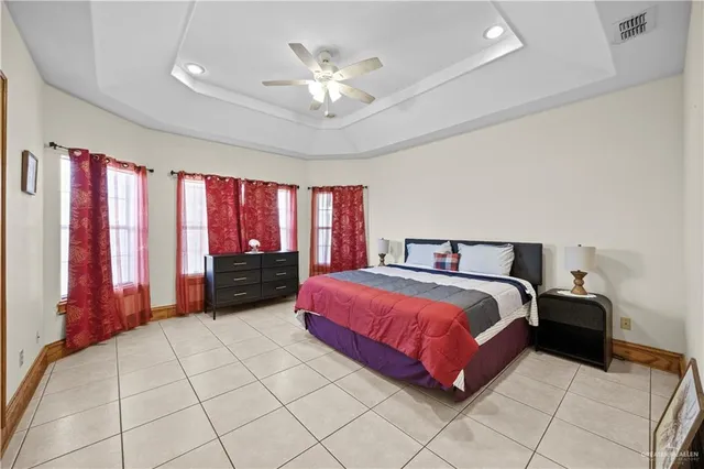 a spacious bathroom with a granite countertop sink a mirror and a shower