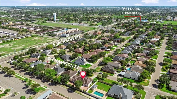 an aerial view of residential houses with outdoor space and street view