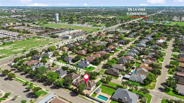an aerial view of residential houses with outdoor space and street view