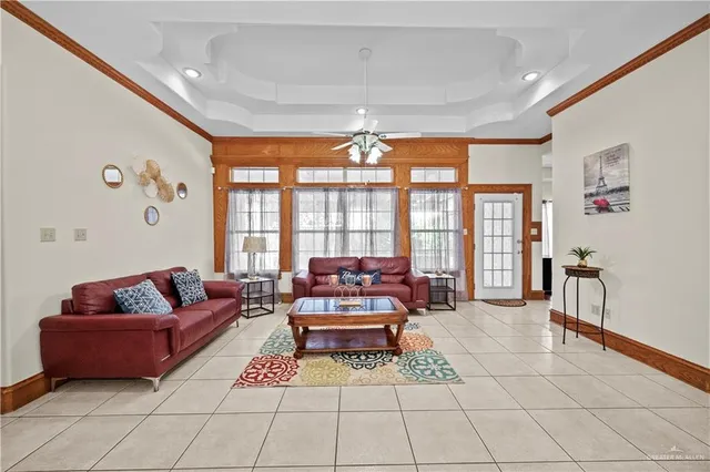 a view of a dining room with furniture and window
