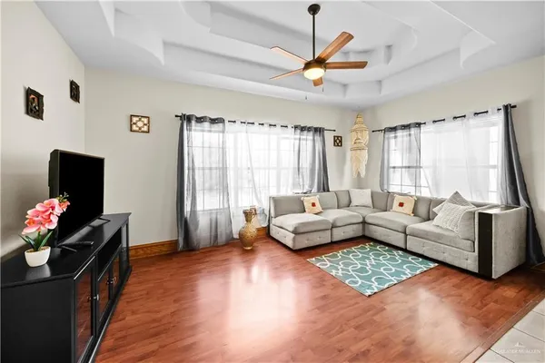 a bathroom with a granite countertop sink a toilet and a mirror