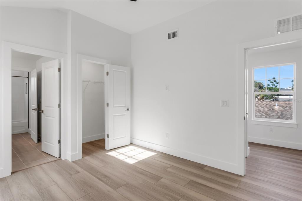 1912 West Chestnut Street Tampa, FL 33607 - Photo 16 of 30 an empty room with wooden floor and windows