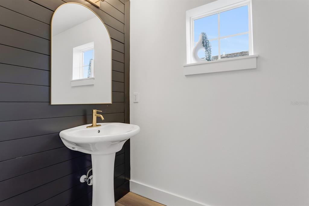 1912 West Chestnut Street Tampa, FL 33607 - Photo 17 of 30 a bathroom with a sink and a mirror