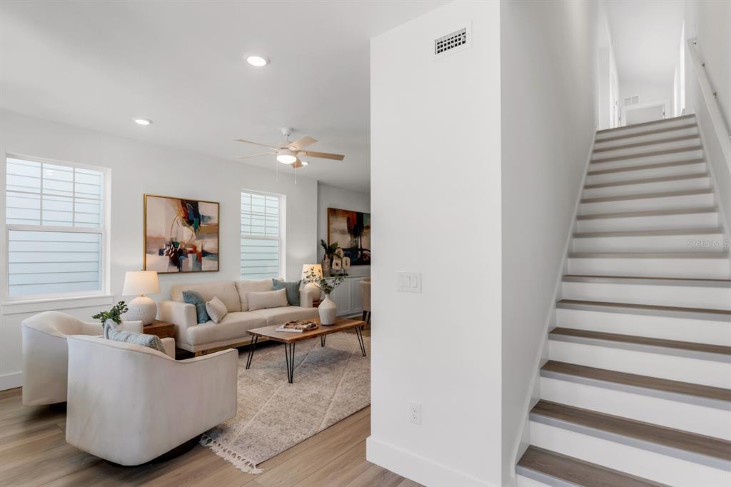 1912 West Chestnut Street Tampa, FL 33607 - Photo 18 of 30 a living room with furniture and a stairs