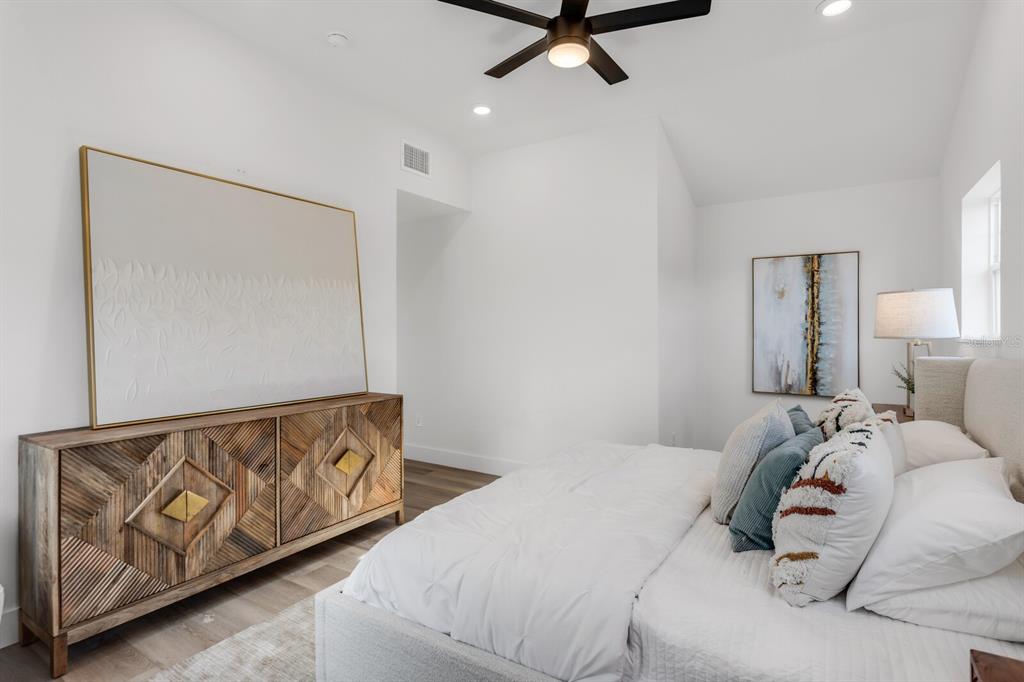 1912 West Chestnut Street Tampa, FL 33607 - Photo 23 of 30 a bedroom with a bed and wooden floor