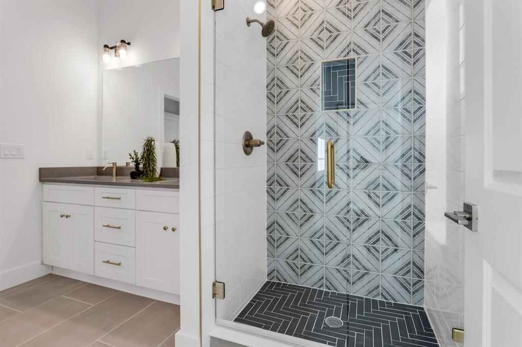 1912 West Chestnut Street Tampa, FL 33607 - Photo 24 of 30 a bathroom with a shower and a sink