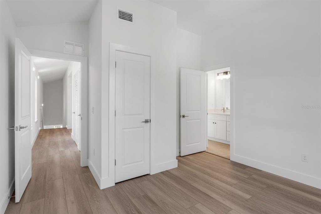 1912 West Chestnut Street Tampa, FL 33607 - Photo 25 of 30 a view of a hallway with wooden floor