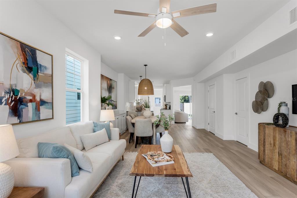 1912 West Chestnut Street Tampa, FL 33607 - Photo 4 of 30 a living room with furniture and a chandelier