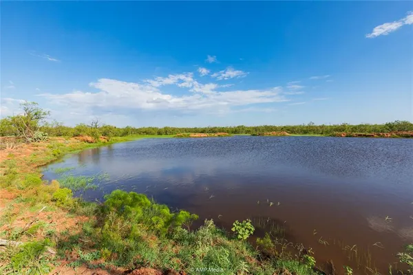 a view of lake with green space