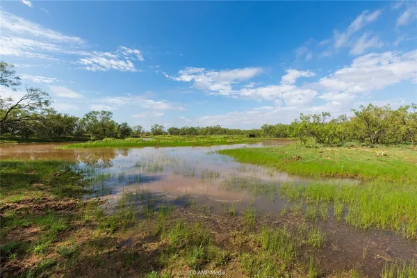 a view of lake with green space