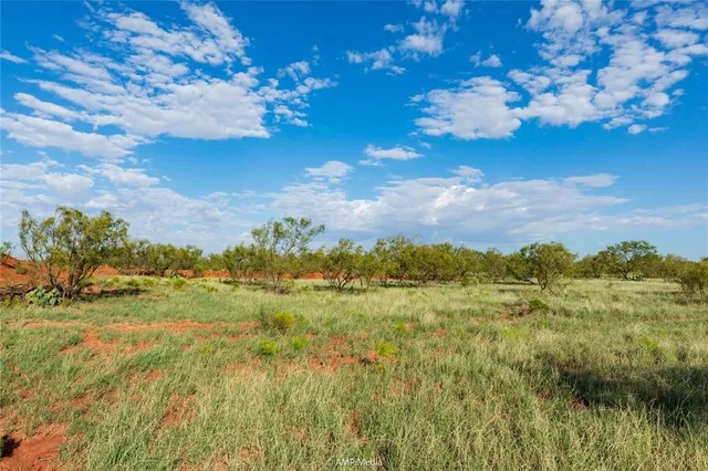 a view of lake with green space