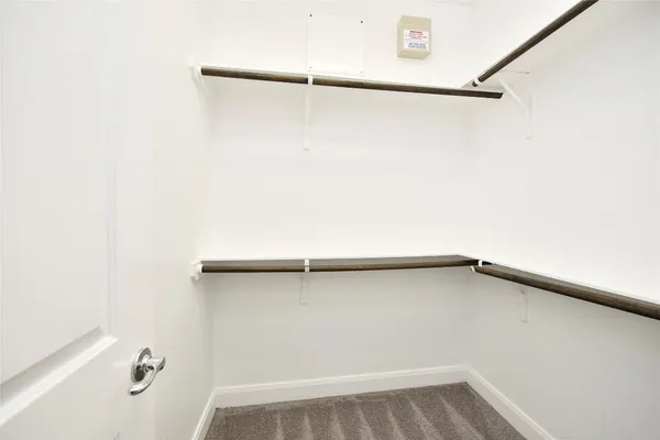 a view of a room with racks on the wall