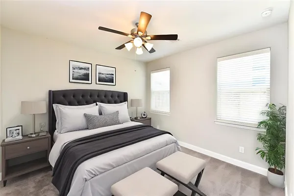 a bedroom with a large bed and a window