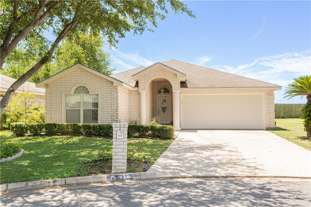 4113 Whitewing Avenue McAllen, TX 78501 - Photo 1 of 1 a front view of a house with a yard