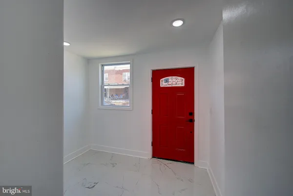 a view of entryway with wooden floor and stairs