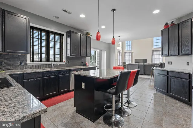 a kitchen with a sink cabinets and window
