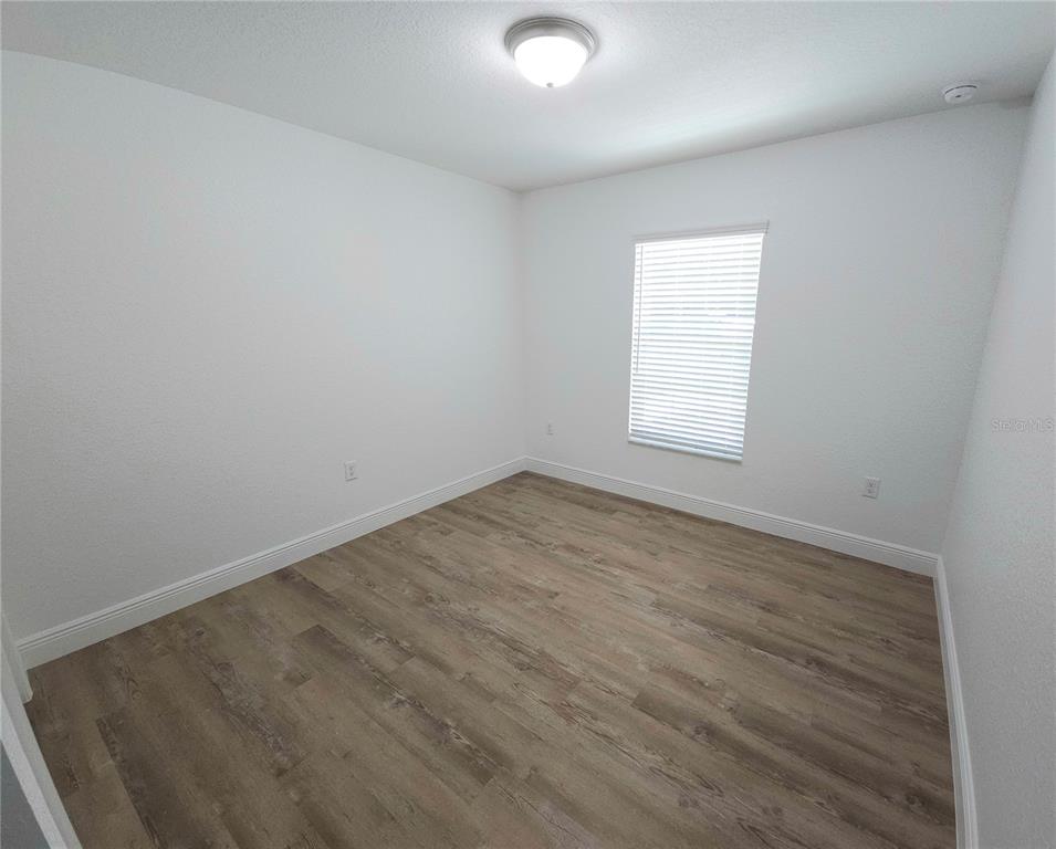 3068 Southwest 131st Place Road Ocala, FL 34473 - Photo 9 of 12 an empty room with a window