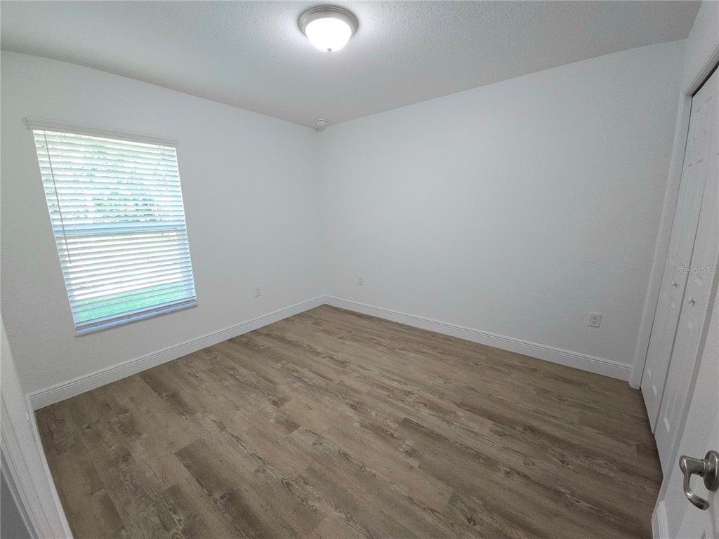 3068 Southwest 131st Place Road Ocala, FL 34473 - Photo 10 of 12 an empty room with a window