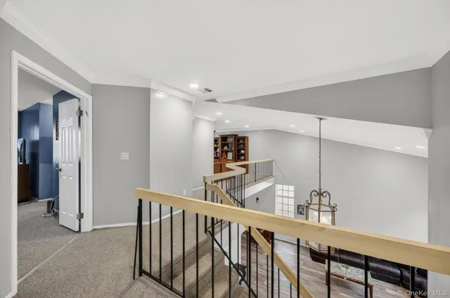 a spacious bedroom with a bed and a large window