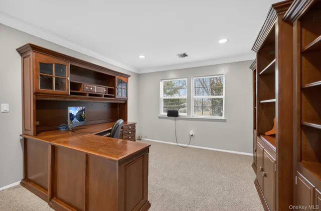 a spacious bedroom with a bed and a large window