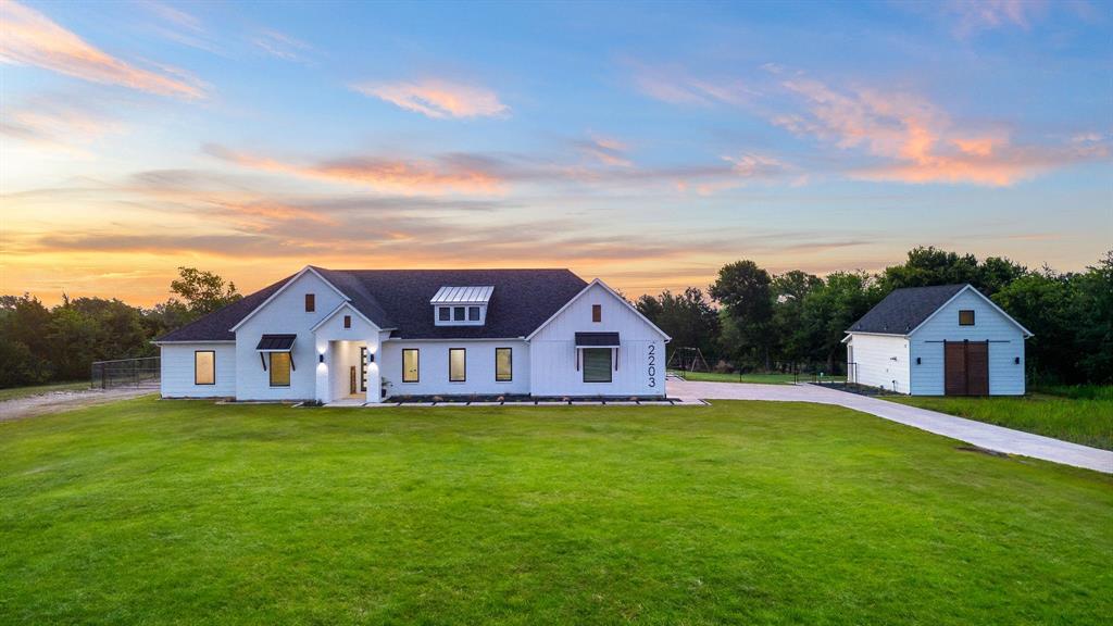 front view of a house with a yard