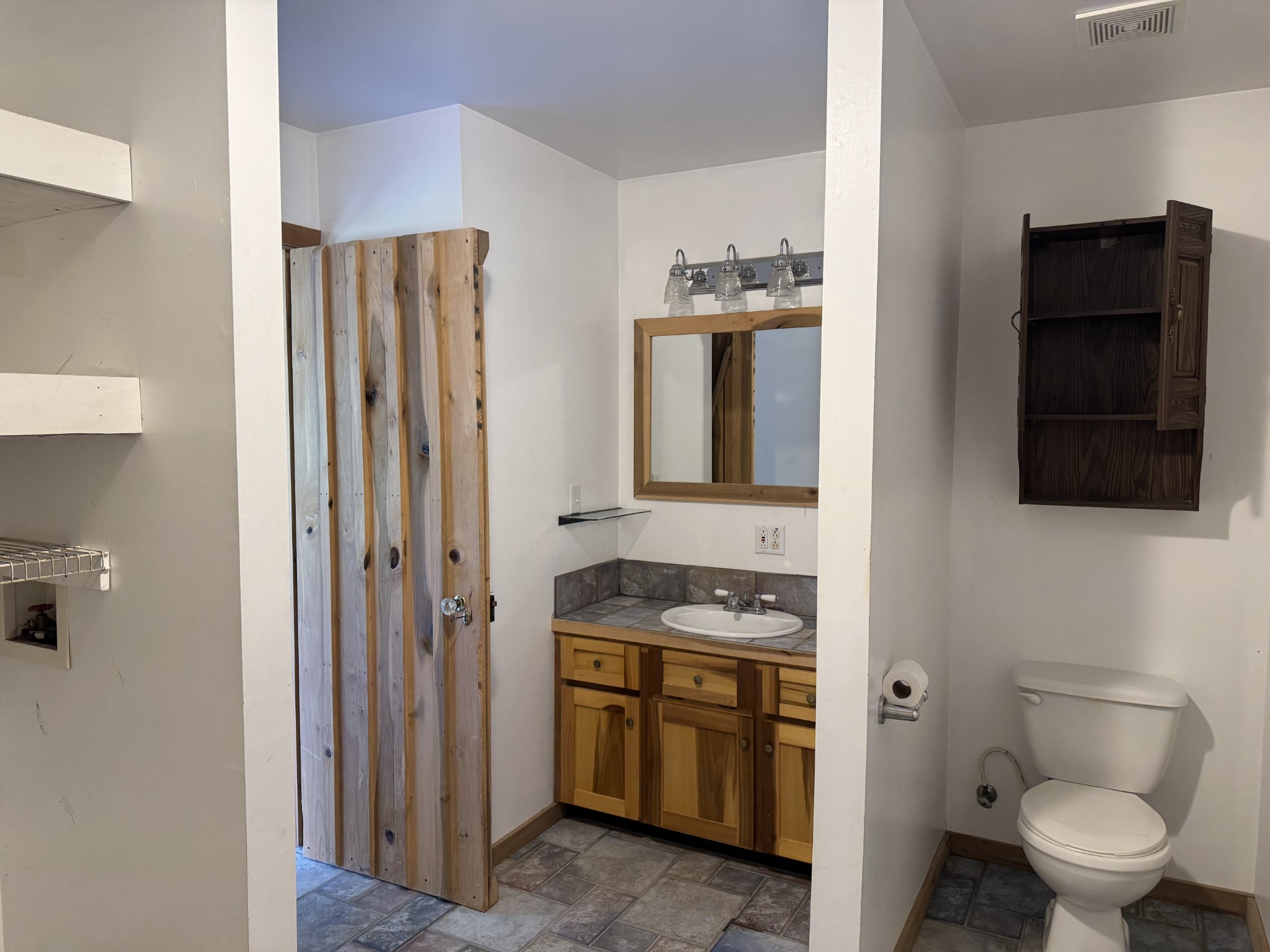 11175 Highway 147 Stewart, TN 37175 - Photo 11 of 29 a bathroom with a toilet sink and mirror