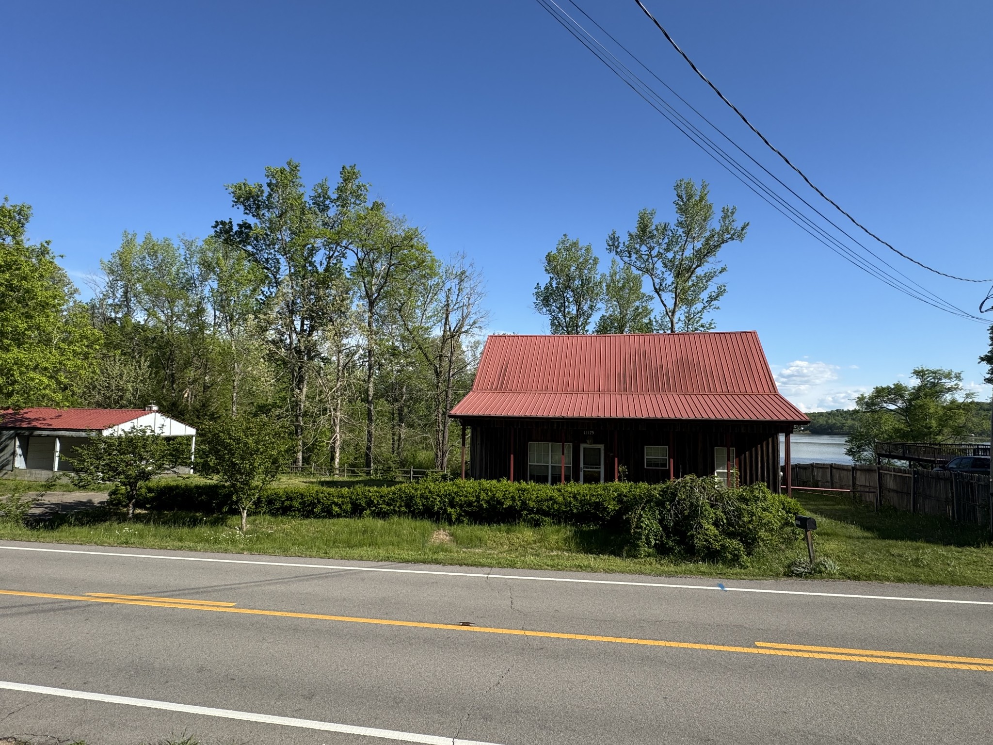 11175 Highway 147 Stewart, TN 37175 - Photo 22 of 29 a front view of a house with a yard and garage