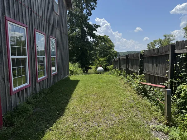 a view of a pathway in front of house