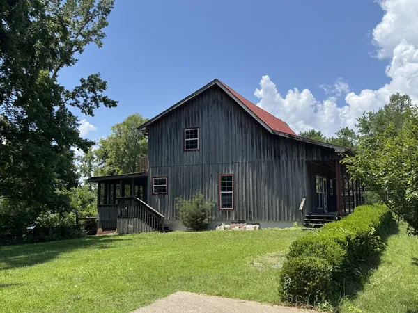 a backyard of a house with lots of green space
