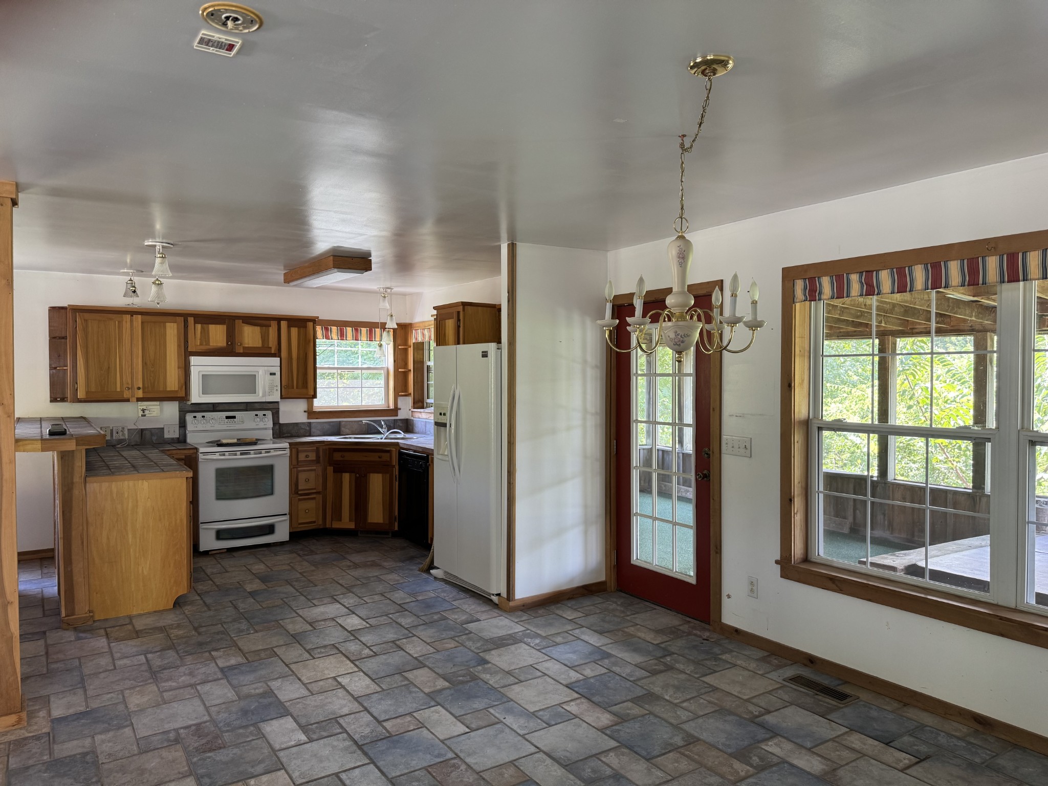 11175 Highway 147 Stewart, TN 37175 - Photo 7 of 29 a kitchen with a stove a sink and a refrigerator