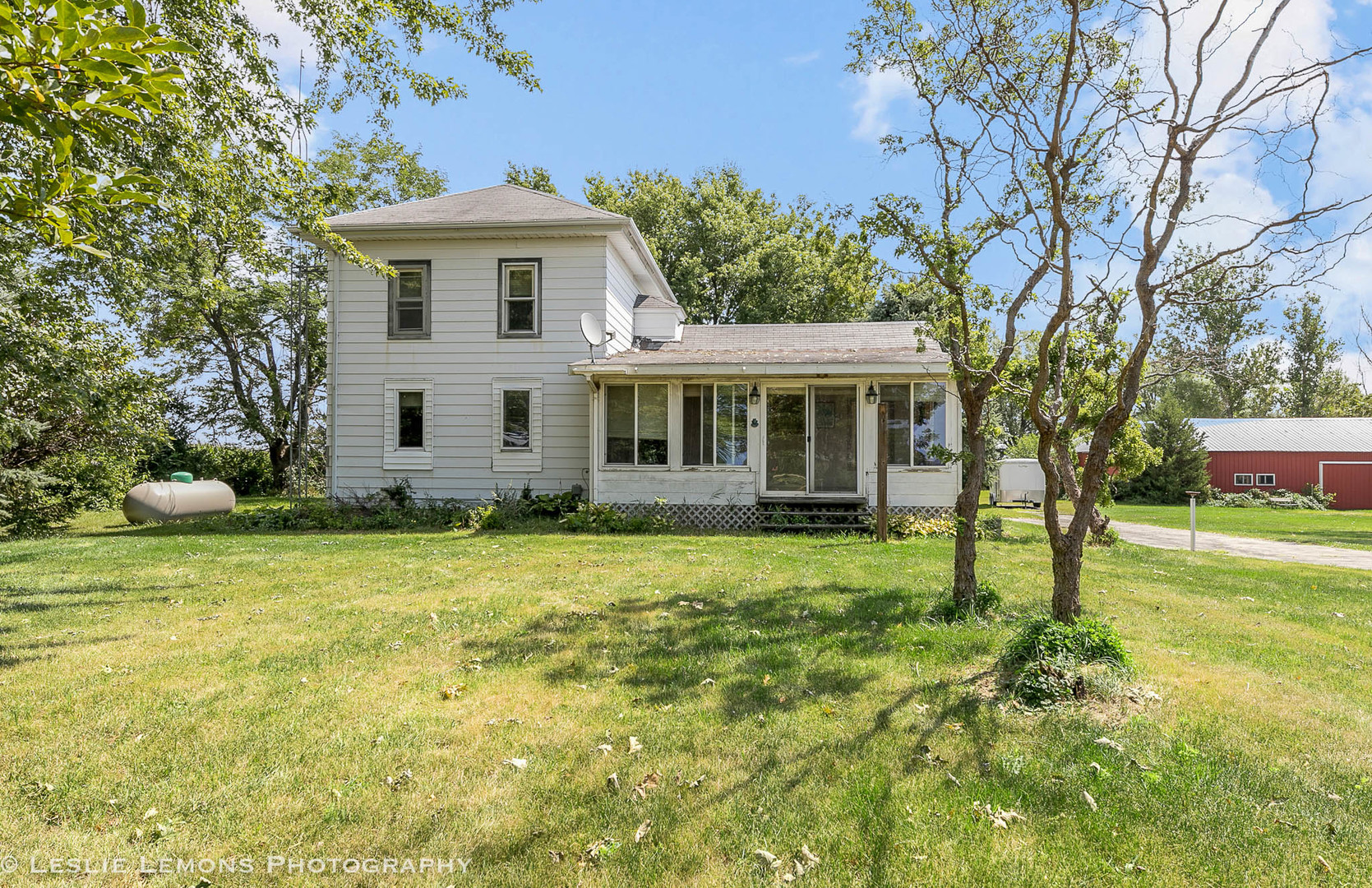 16276 Willrett Road Malta, IL 60150 - Photo 1 of 25 a front view of a house with a yard