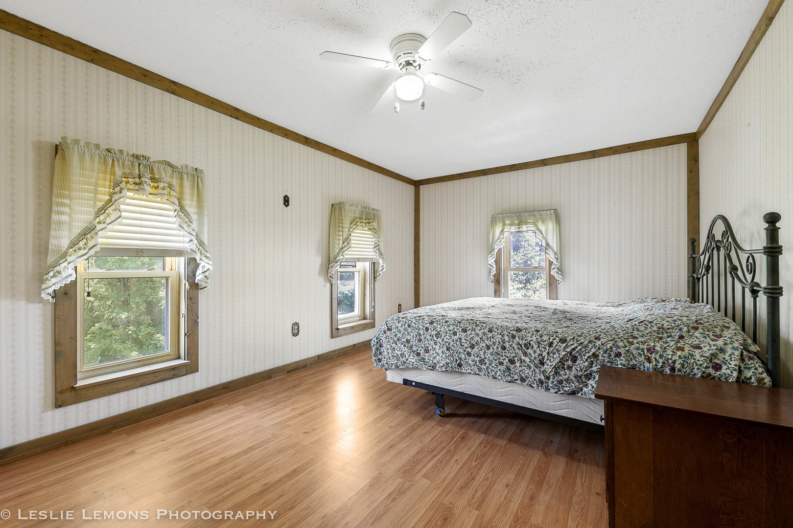 16276 Willrett Road Malta, IL 60150 - Photo 14 of 25 a bedroom with a bed and a chandelier