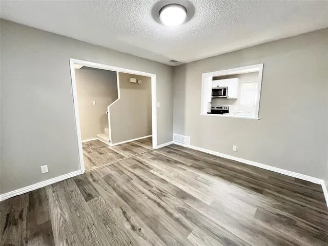 a view of a livingroom with wooden floor