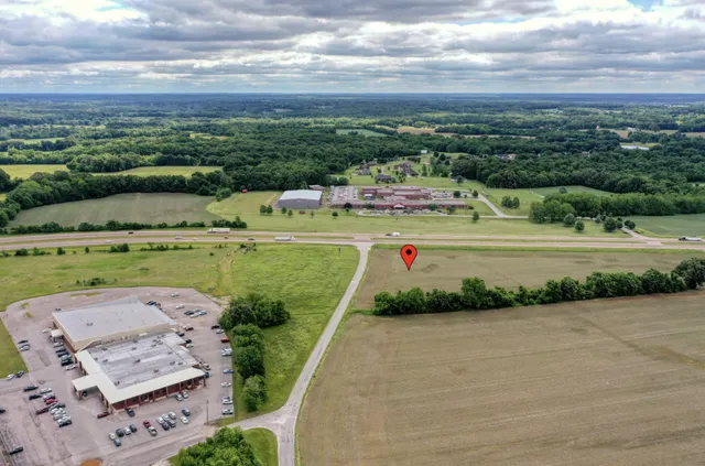an aerial view of a house with a yard