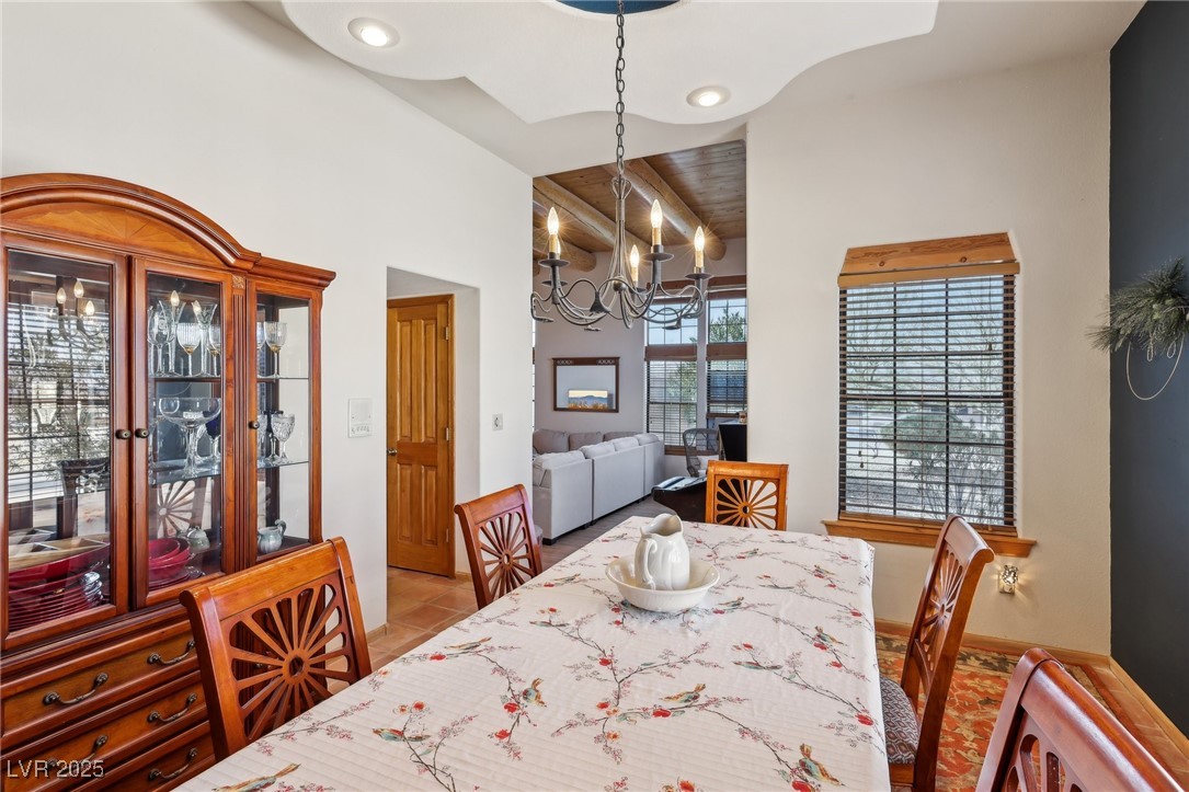 519 North Racetrack Road Henderson, NV 89015 - Photo 24 of 98 Tiled dining area featuring lofted ceiling, a notable chandelier, and recessed lighting